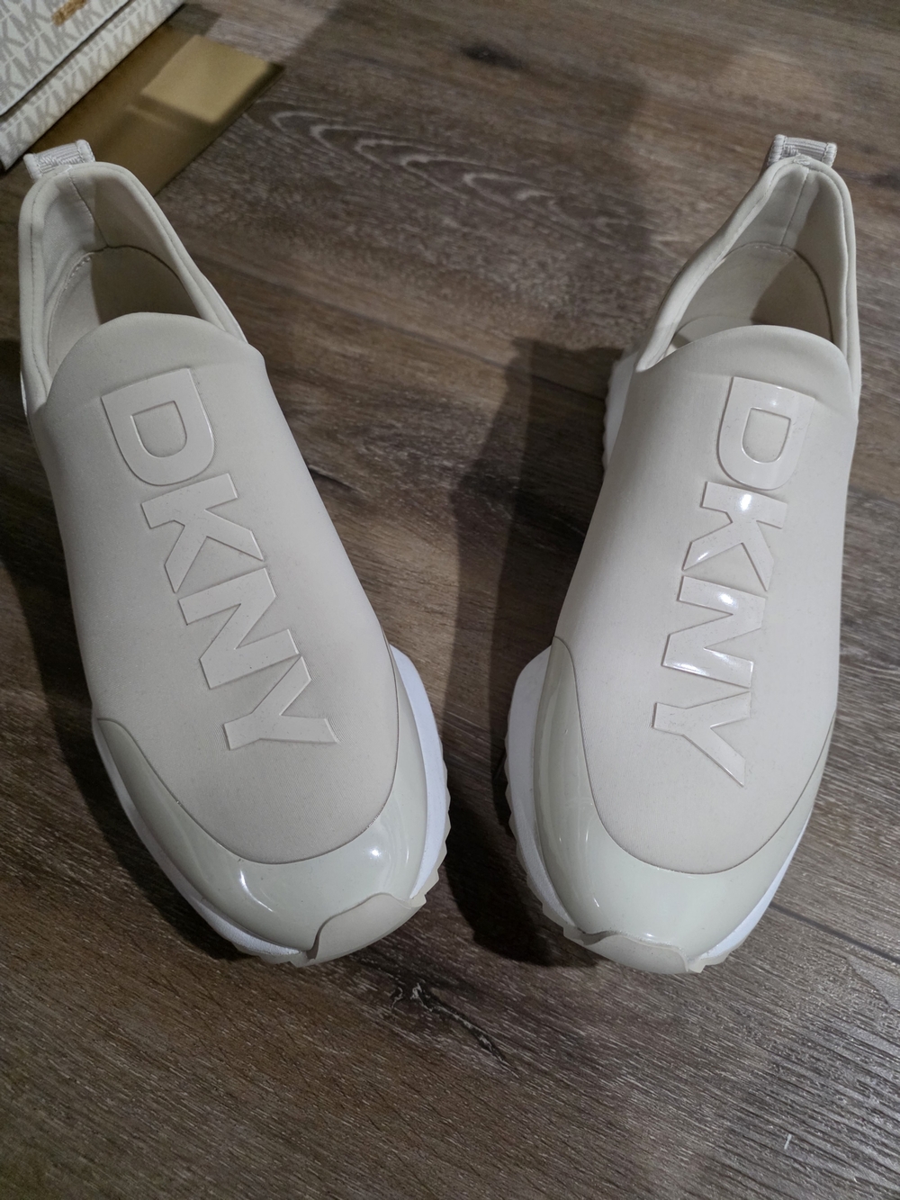 DKNY Women’s Slip-On Sneakers in Cream
